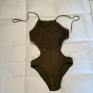 Gorgeous Olive Green Swimsuit with cut out sides. Crocheted detail on front.